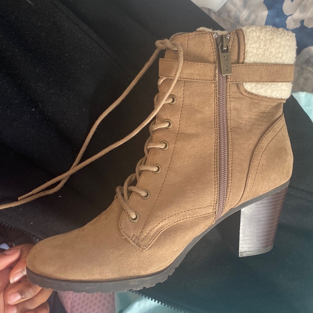 Brown fur lined heeled shoes.